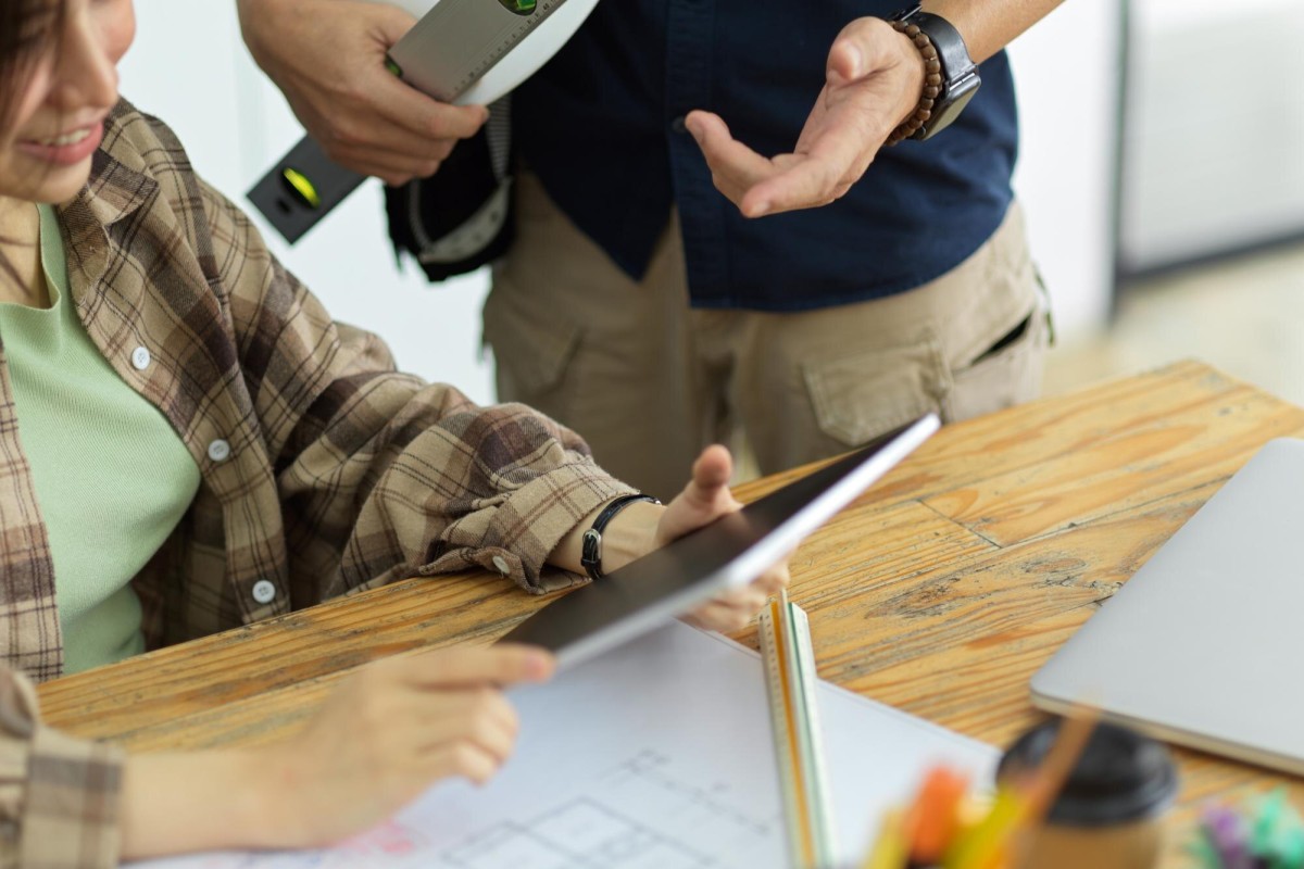 Businessman reviewing custom sign quote paperwork